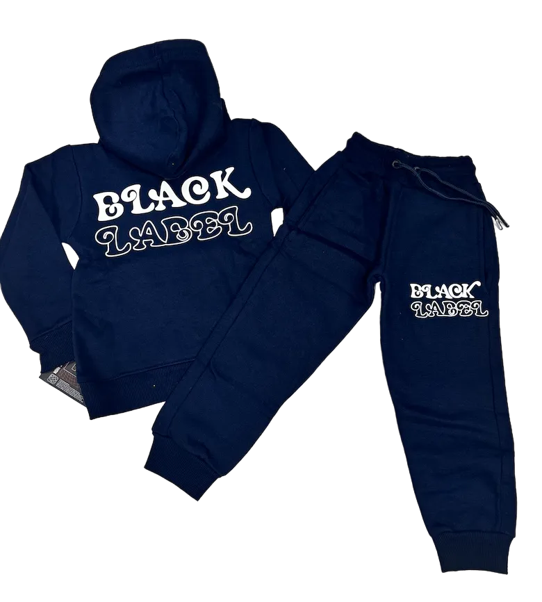 A navy blue hoodie and matching jogger pants set laid flat on a beige tiled floor. The hoodie shows the back view with 'BLACK LABEL' printed in white across the shoulders, and the pants show the front view with the same logo on the upper thigh.